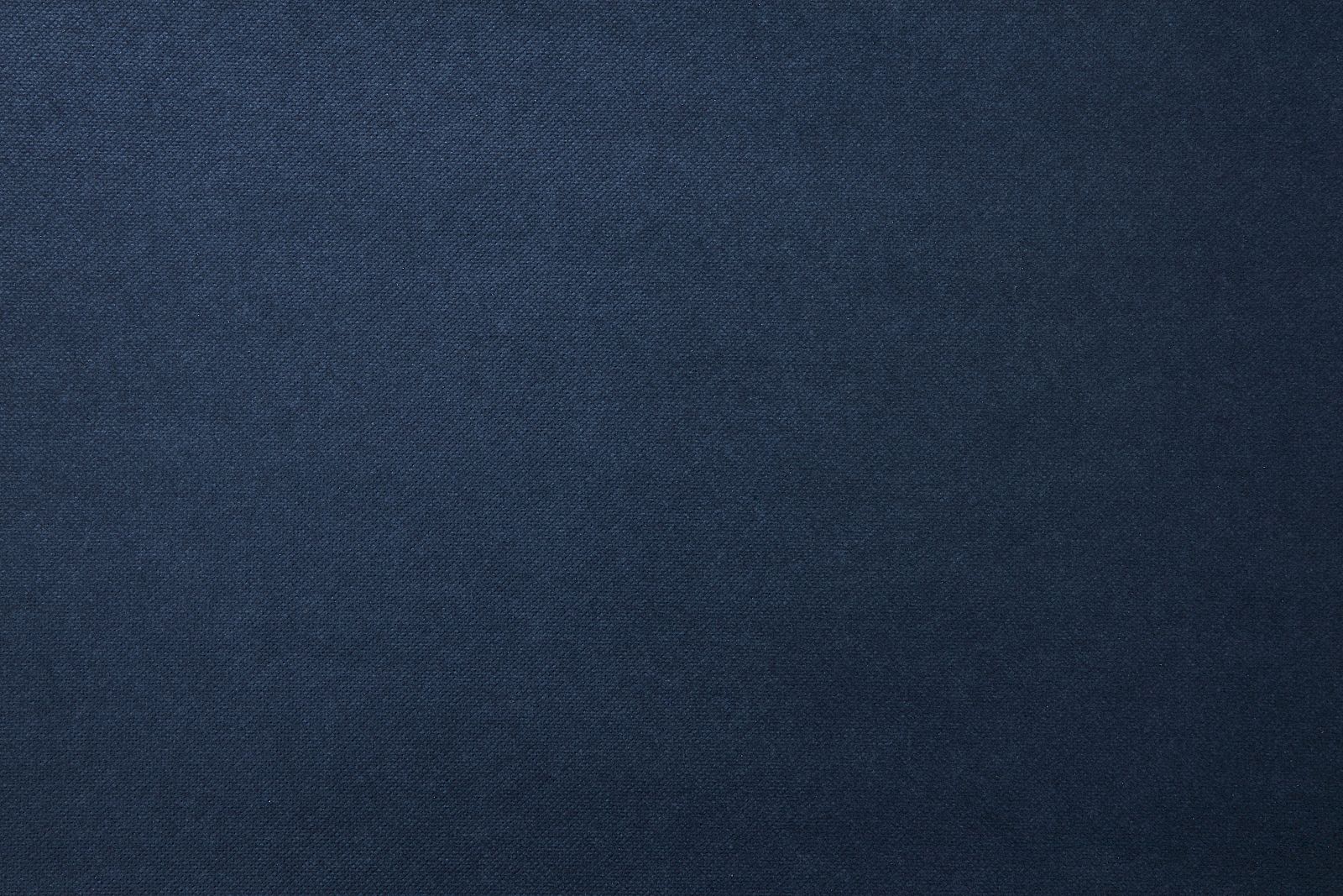 The image shows a plain surface with a dark blue fabric texture, providing a simple and uniform background.